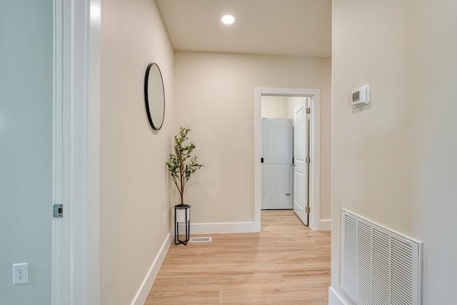 corridor featuring light hardwood / wood-style floors