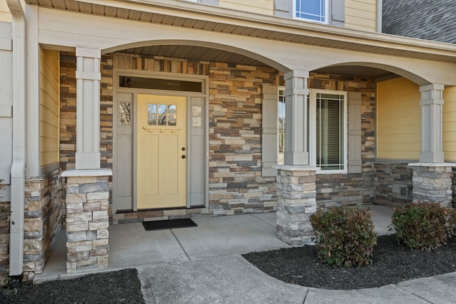 entrance to property featuring covered porch