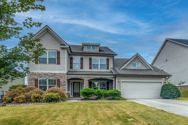 view of front of home featuring a garage and a front yard