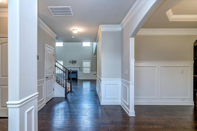 hallway featuring ornamental molding and dark wood-type flooring