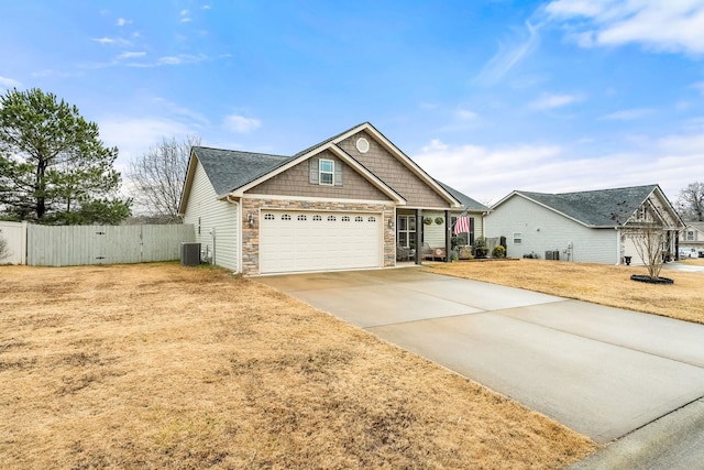 craftsman inspired home featuring central AC and a front lawn