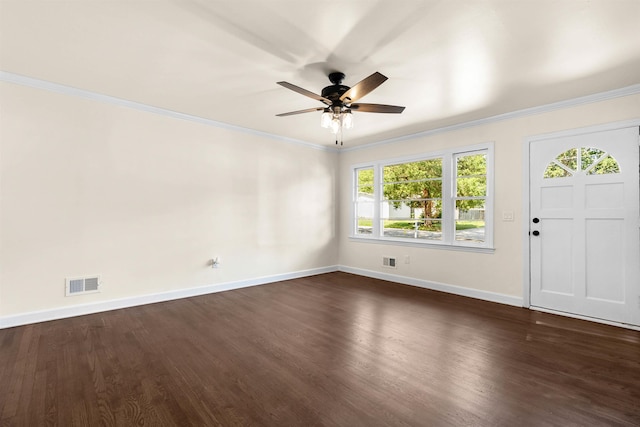 interior space with ornamental molding, ceiling fan, and dark hardwood / wood-style flooring