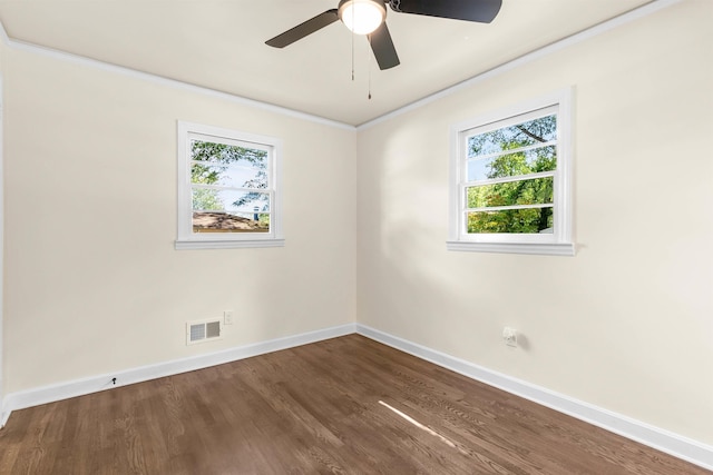 unfurnished room featuring crown molding, dark wood-type flooring, and ceiling fan