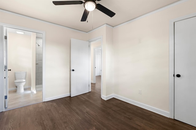 unfurnished bedroom featuring dark hardwood / wood-style floors, connected bathroom, and ceiling fan