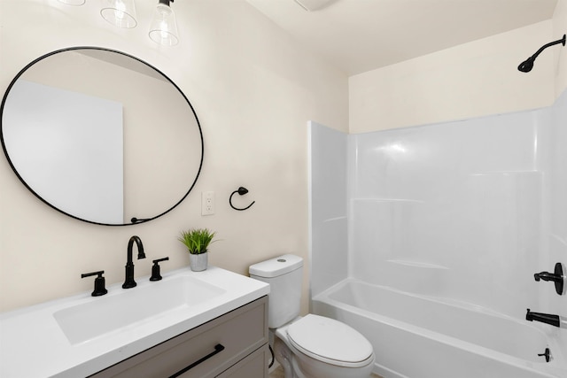 full bathroom featuring vanity, toilet, and washtub / shower combination