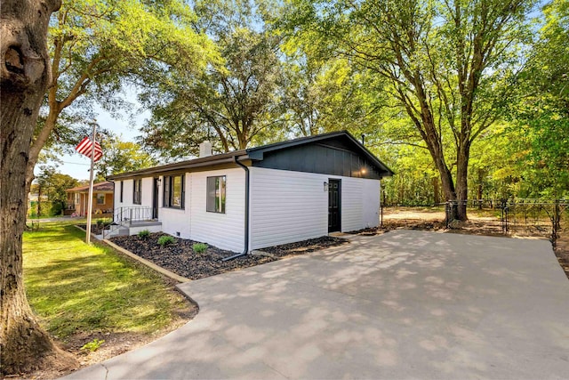 view of side of property with a yard