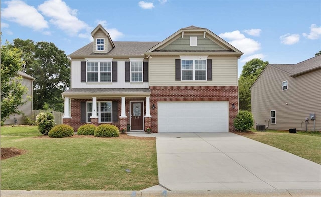 view of front of house featuring a garage, a front lawn, central air condition unit, and covered porch