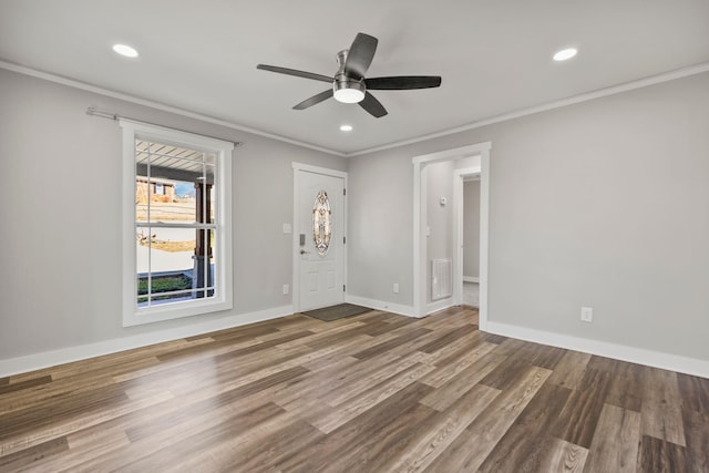 interior space with crown molding, ceiling fan, and hardwood / wood-style floors