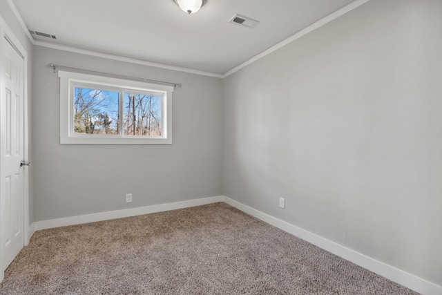 unfurnished room featuring carpet floors and ornamental molding