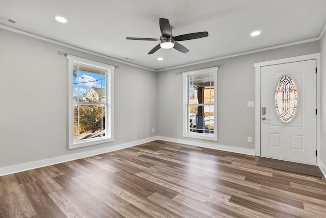 foyer entrance featuring hardwood / wood-style floors and ornamental molding