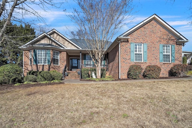 view of front of home featuring a porch and a front yard