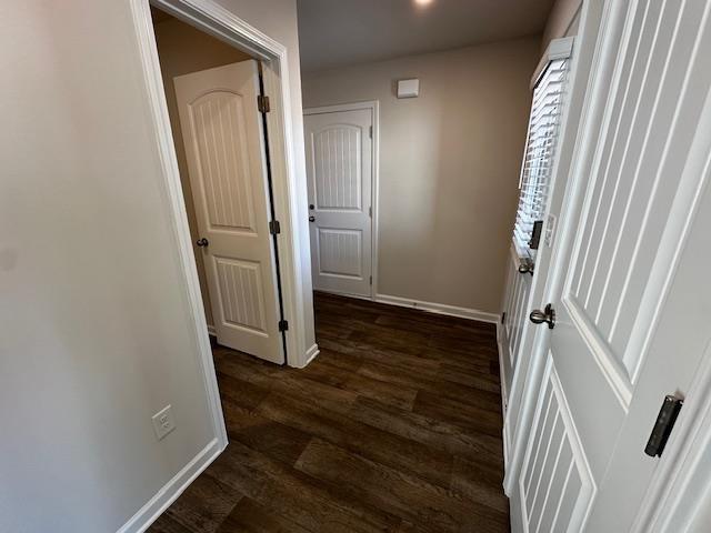 hall with dark hardwood / wood-style floors