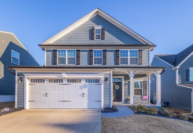 view of front of home with a garage and covered porch