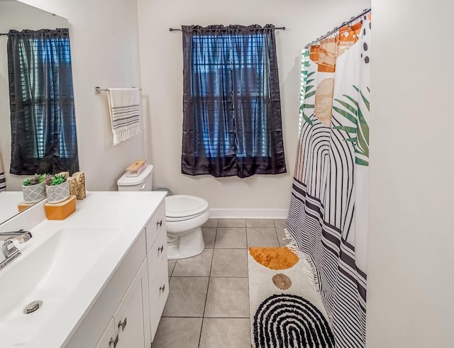 bathroom featuring vanity, tile patterned floors, and toilet