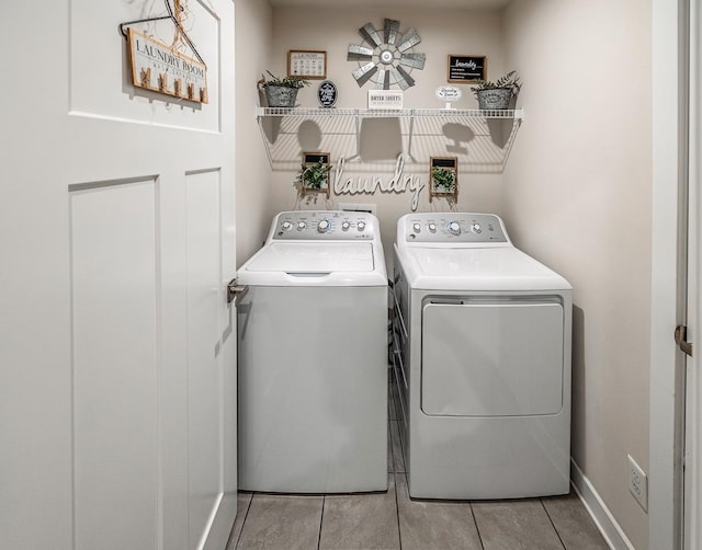 laundry area with washing machine and clothes dryer