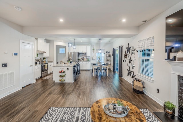 living room with dark hardwood / wood-style flooring