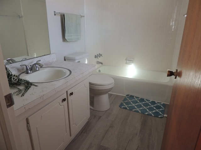 full bathroom featuring vanity, wood-type flooring, toilet, and shower / bath combination