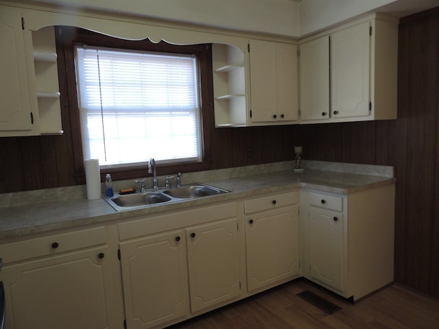 kitchen featuring sink, white cabinets, and dark hardwood / wood-style floors