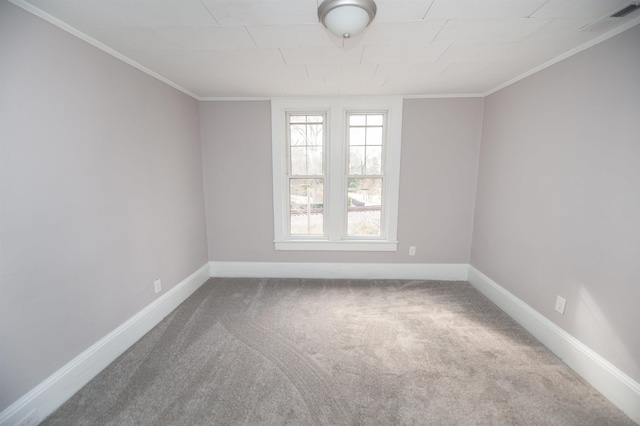 empty room featuring ornamental molding and carpet flooring