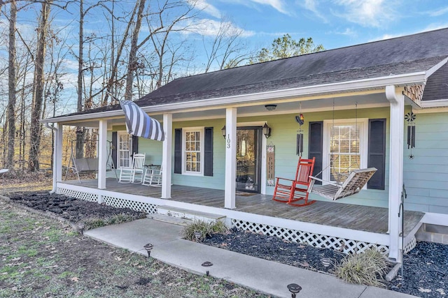 entrance to property featuring covered porch