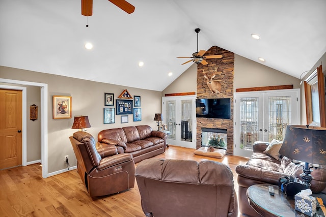 living room featuring french doors, ceiling fan, high vaulted ceiling, and light hardwood / wood-style flooring