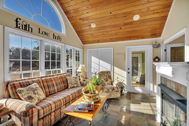 sunroom / solarium featuring vaulted ceiling and wooden ceiling