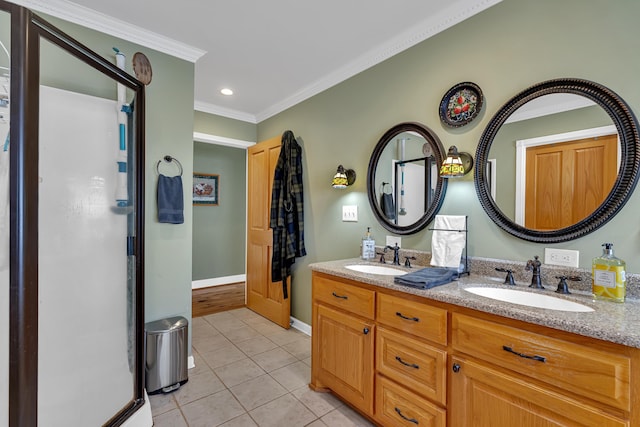 bathroom featuring tile patterned flooring, vanity, and crown molding