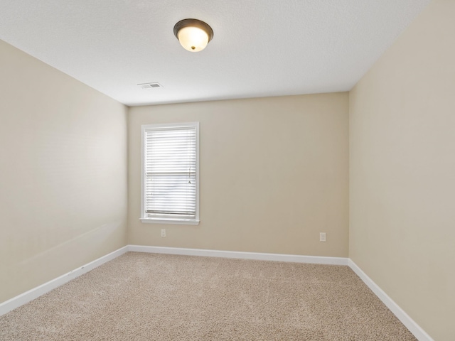 unfurnished room featuring carpet floors