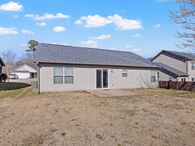 back of house with a yard, central AC, and a patio