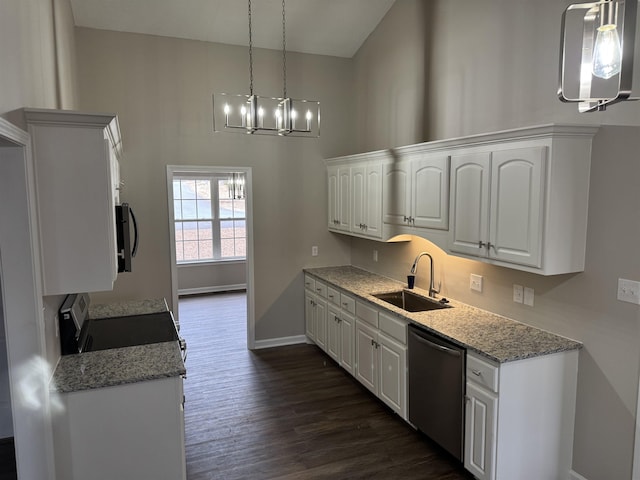 kitchen featuring white cabinetry, sink, decorative light fixtures, and appliances with stainless steel finishes