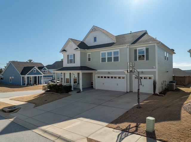 front of property with a porch, a garage, and central air condition unit