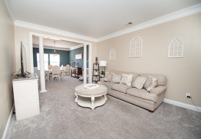 carpeted living room with decorative columns and crown molding