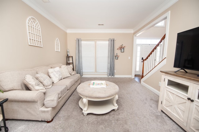 living room featuring crown molding and carpet floors