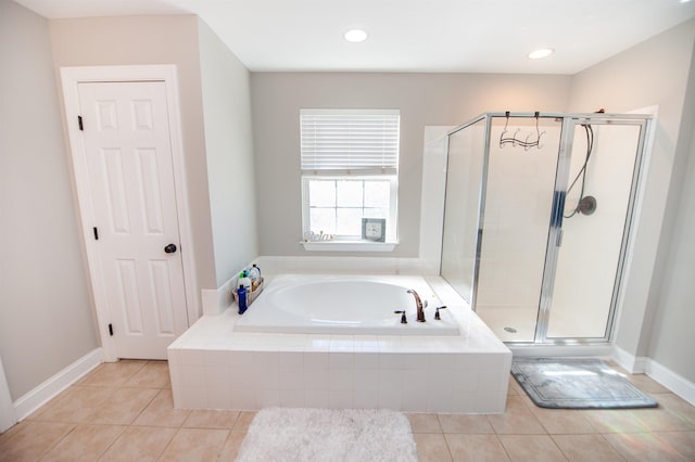 bathroom with tile patterned flooring and independent shower and bath