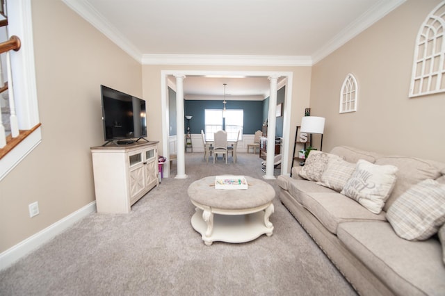 carpeted living room with crown molding and ornate columns