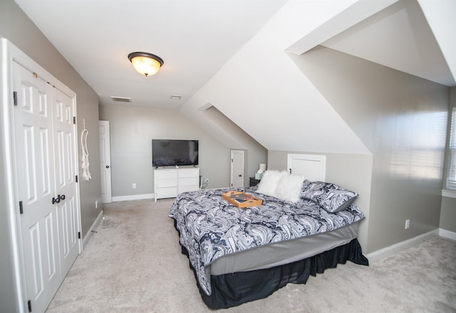 carpeted bedroom featuring vaulted ceiling