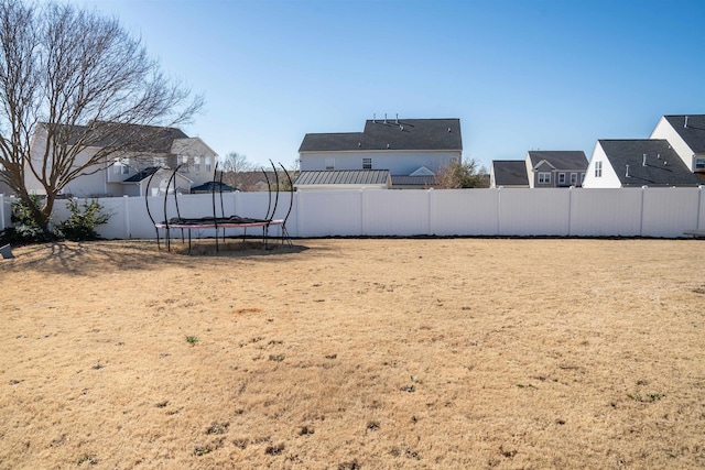 view of yard with a trampoline