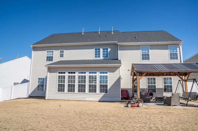 rear view of house featuring a patio