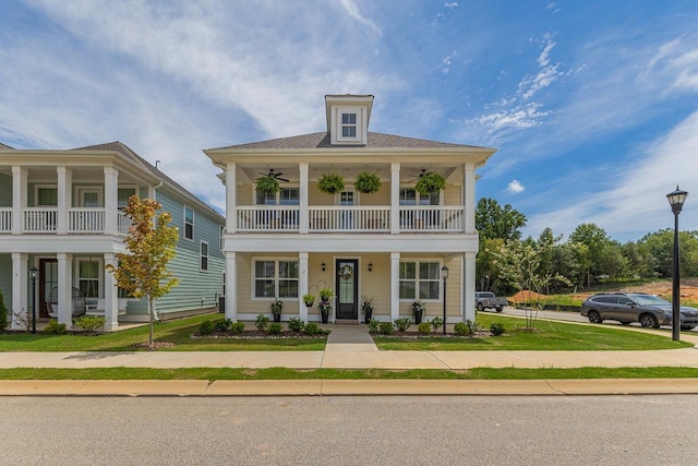 view of front of home featuring a porch and a balcony