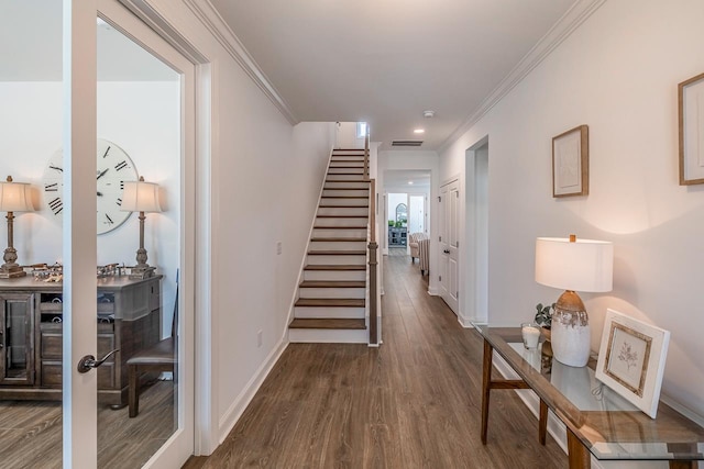 hall with crown molding and dark hardwood / wood-style floors