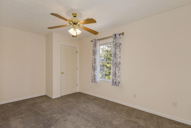 carpeted empty room featuring ceiling fan