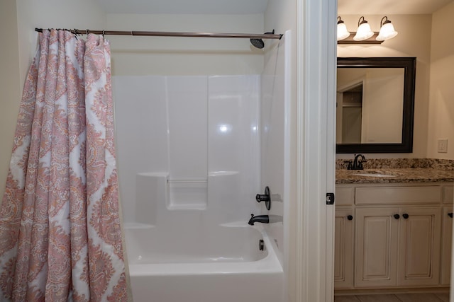 bathroom with shower / tub combo with curtain and vanity