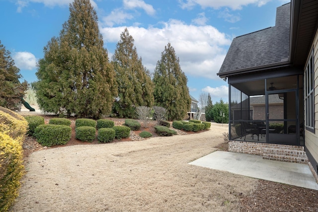 view of yard featuring a sunroom