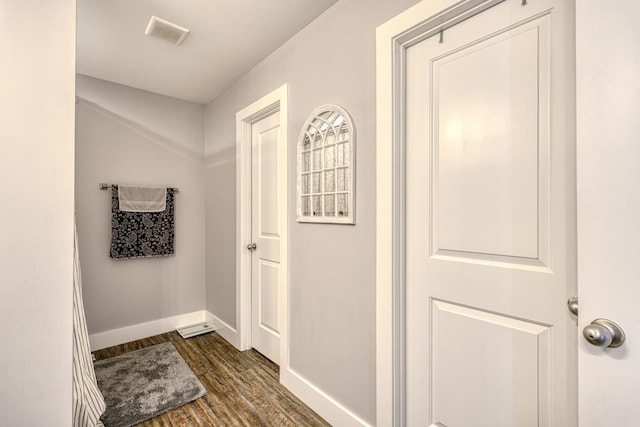 corridor featuring dark wood-type flooring