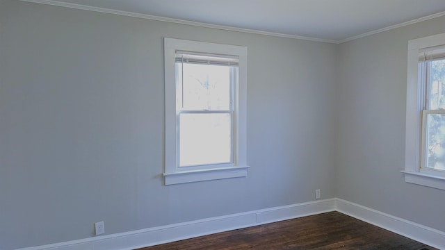 empty room with crown molding and dark wood-type flooring