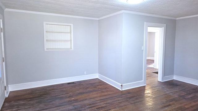 empty room with dark hardwood / wood-style flooring, ornamental molding, and built in features