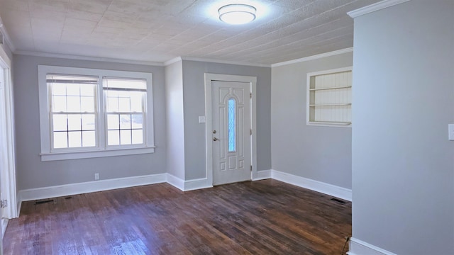 foyer featuring crown molding and dark wood-type flooring