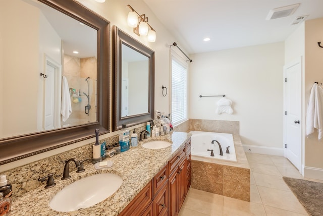 bathroom featuring tile patterned floors, plus walk in shower, and vanity