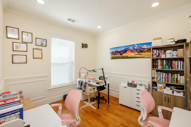 home office with ornamental molding and light wood-type flooring