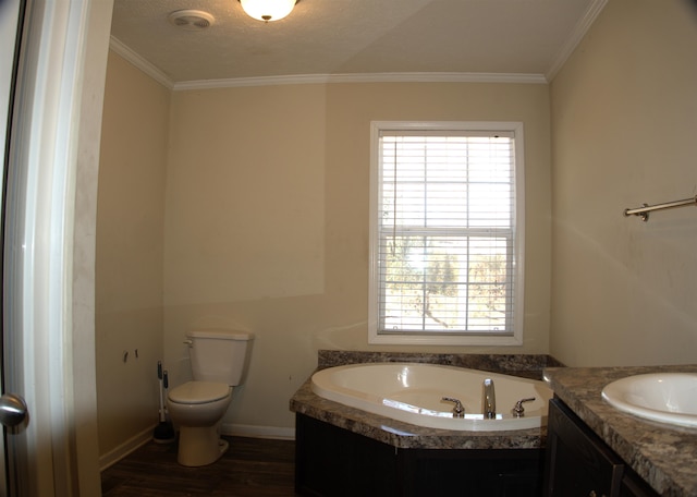 bathroom with hardwood / wood-style flooring, ornamental molding, a washtub, and toilet